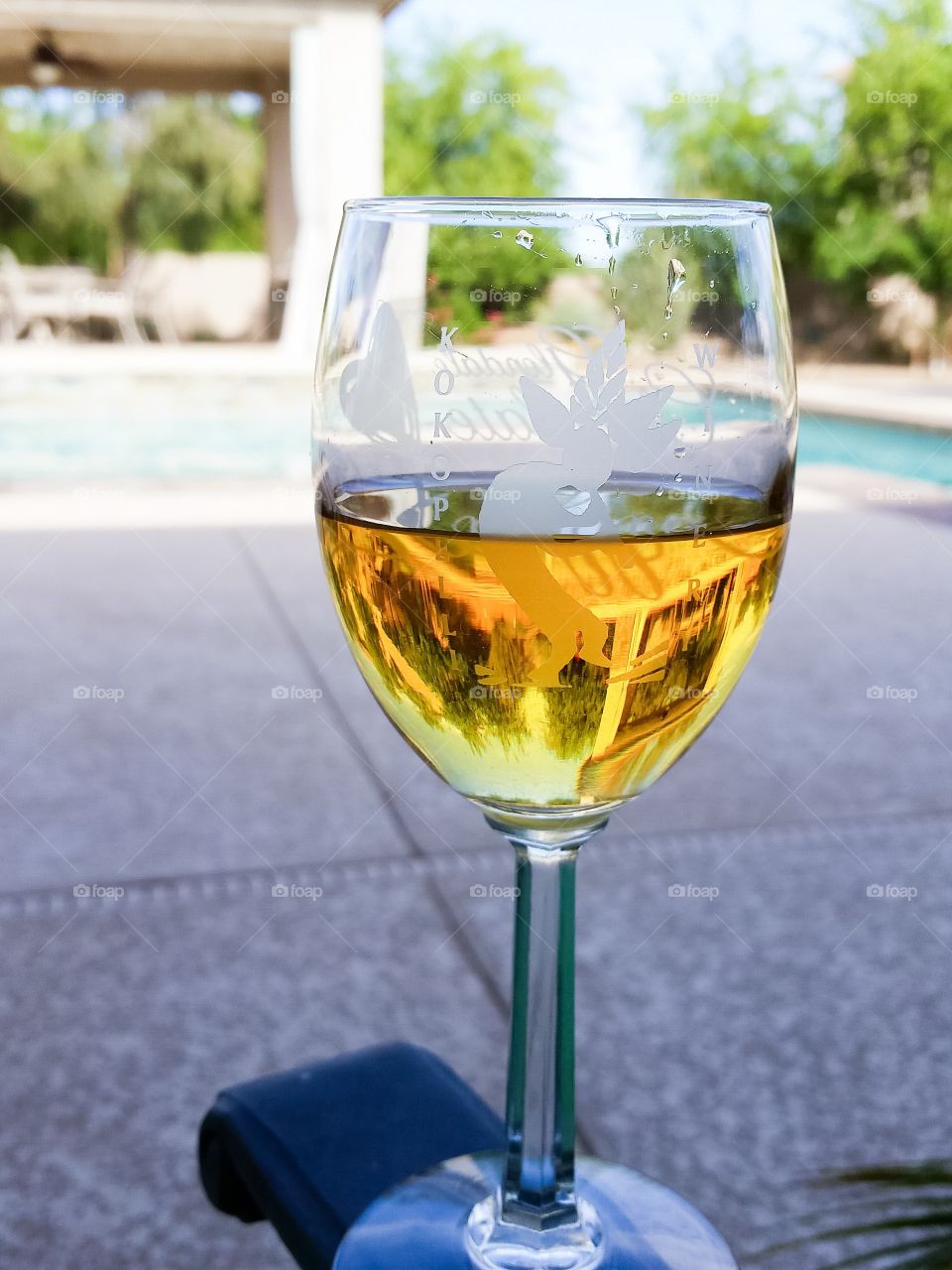 Enjoying a dessert wine by the pool