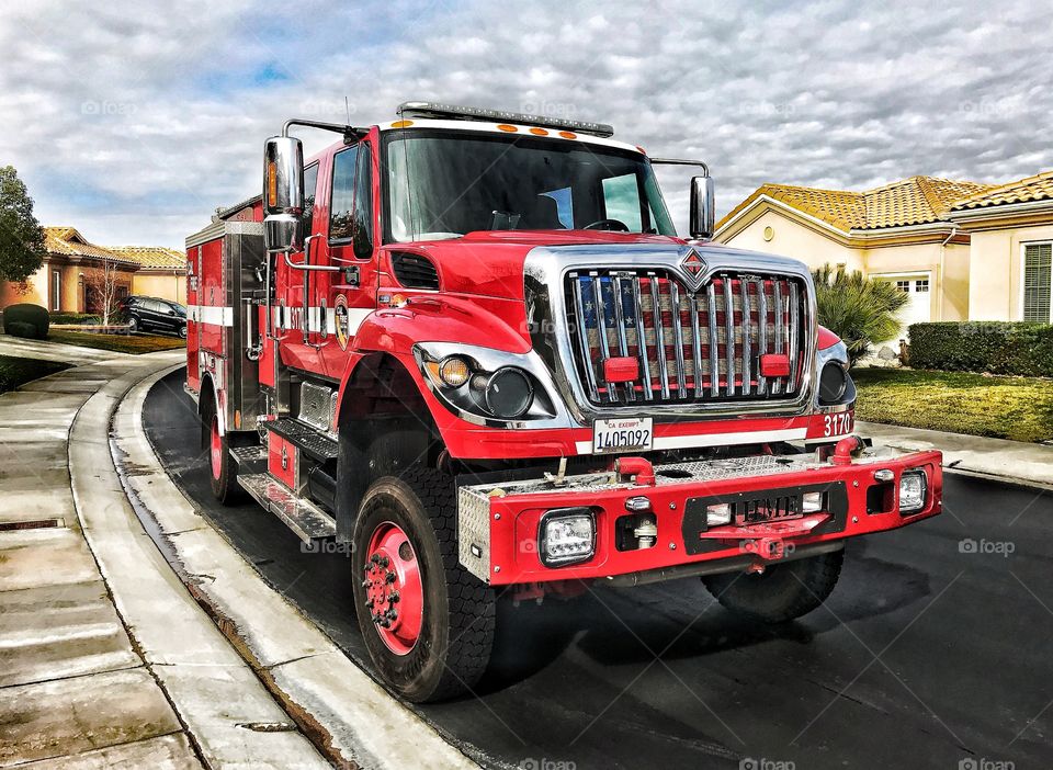 Red fire truck parked on a suburban street
