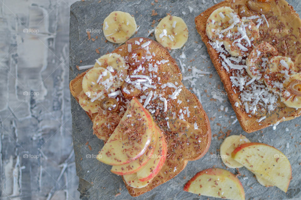 Peanut butter and apple sandwich is our favourite on wheat bread,healthy and delicious with sprinkle of grated coconut 