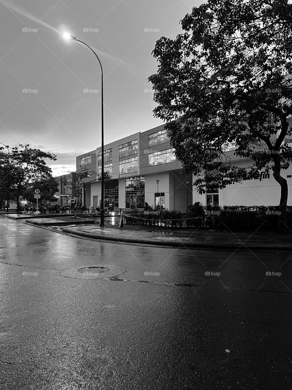 A wet street after the rain - the architecture in a cold day