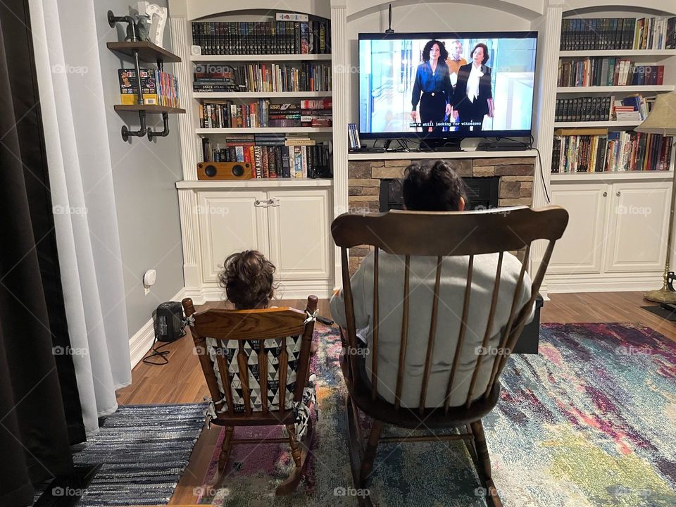 Mommy and toddler watching movie together in rocking chairs, mother and toddler watching movie, mother and toddler rocking in rocking chairs who or watching a movie, like mother like daughter, watching TV together as a family, toddler copy cat