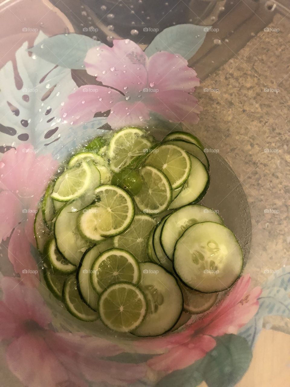 Lovely green sliced limes in a bowl beckoning for someone to use them. 