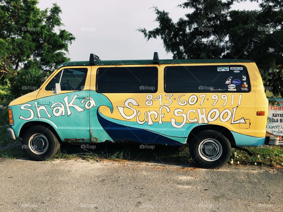 A painted van at the beach.