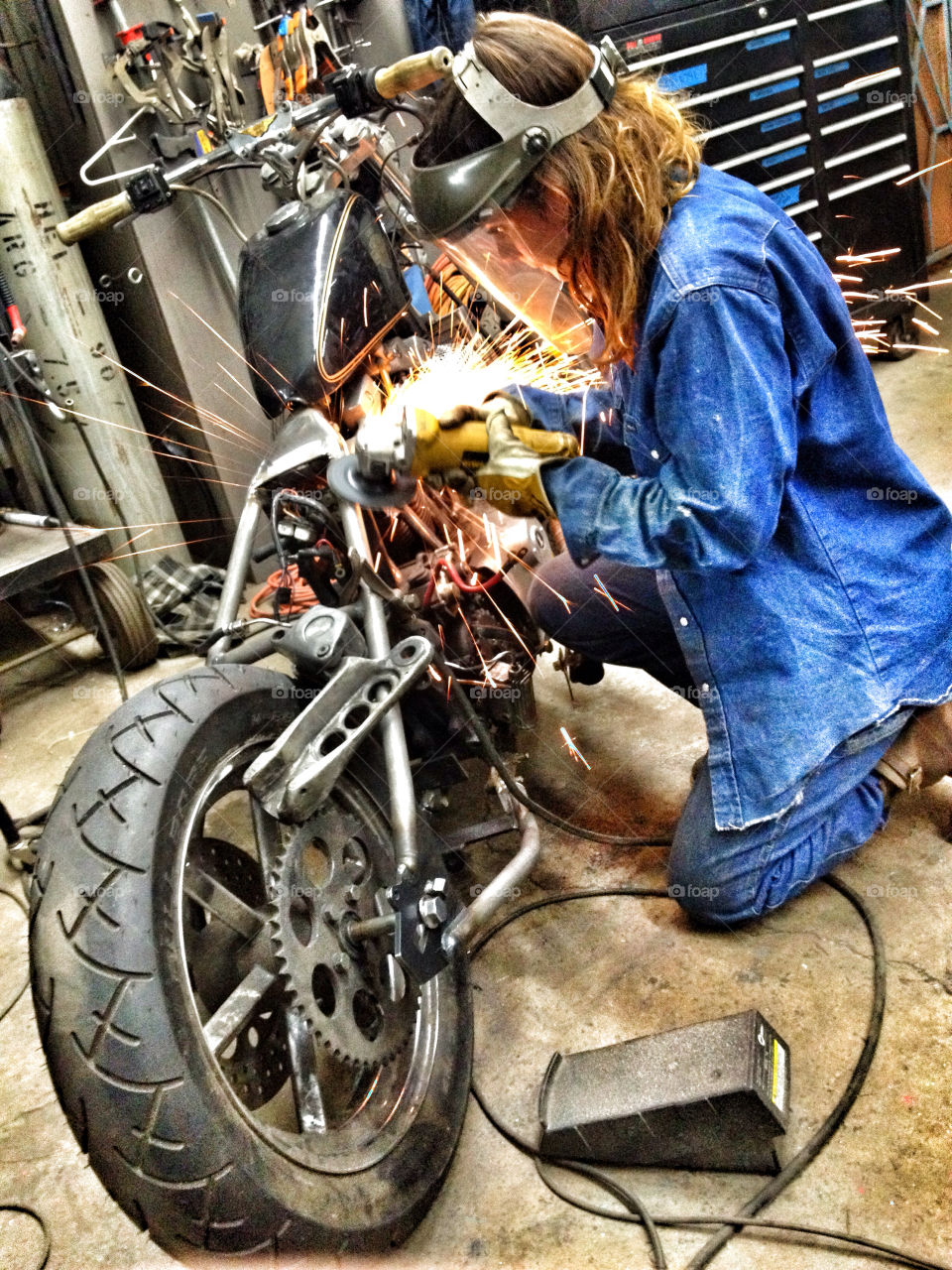 woman metal work motorcycle by shuttermonkey