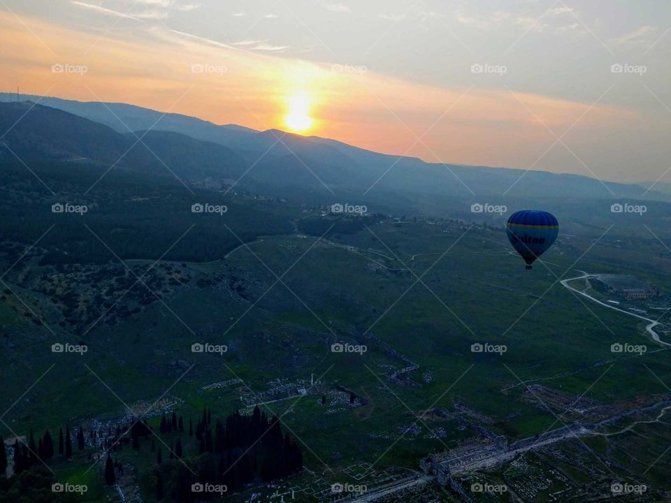 sunrise, sunset and the moon: saw sunrise took hot air balloon. whole valley landscape.