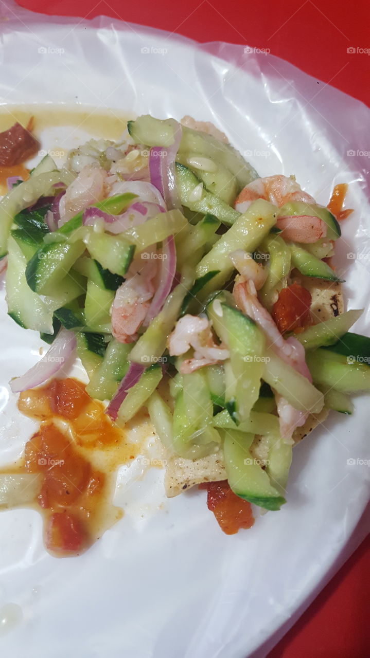 Gustan una rica tostada de Aguachile