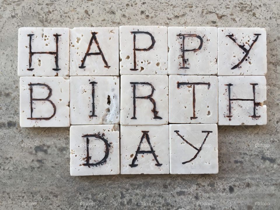 Happy Birthday on carved marble pieces