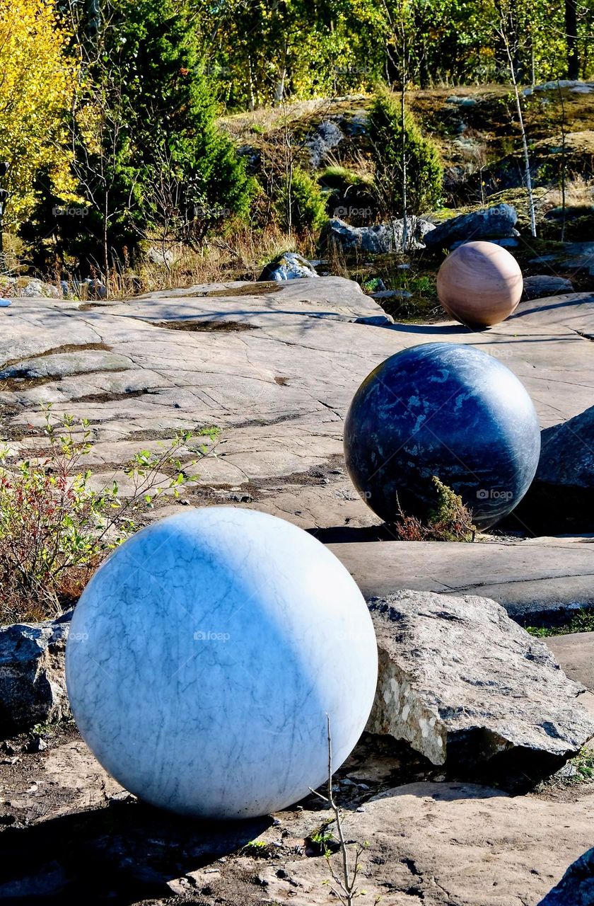 Art object: three round smooth surface sphere from the natural stones