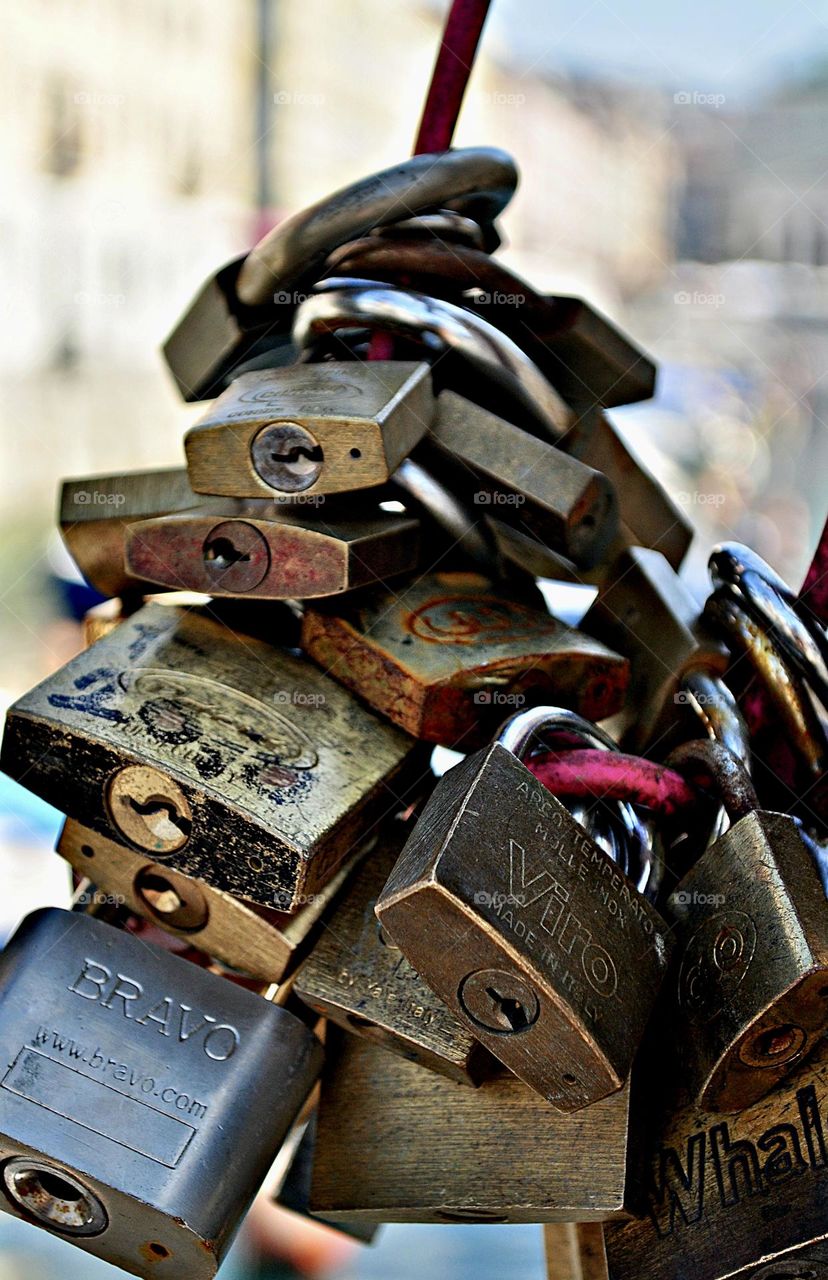 Love locks, metal padlock placed on a bridge representing commitment to each others and love 