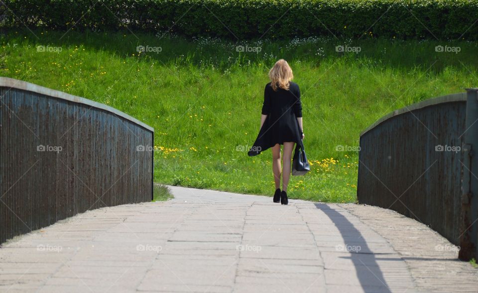 woman on pedestrian bridge