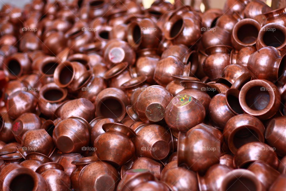 A copper utensils in a lot