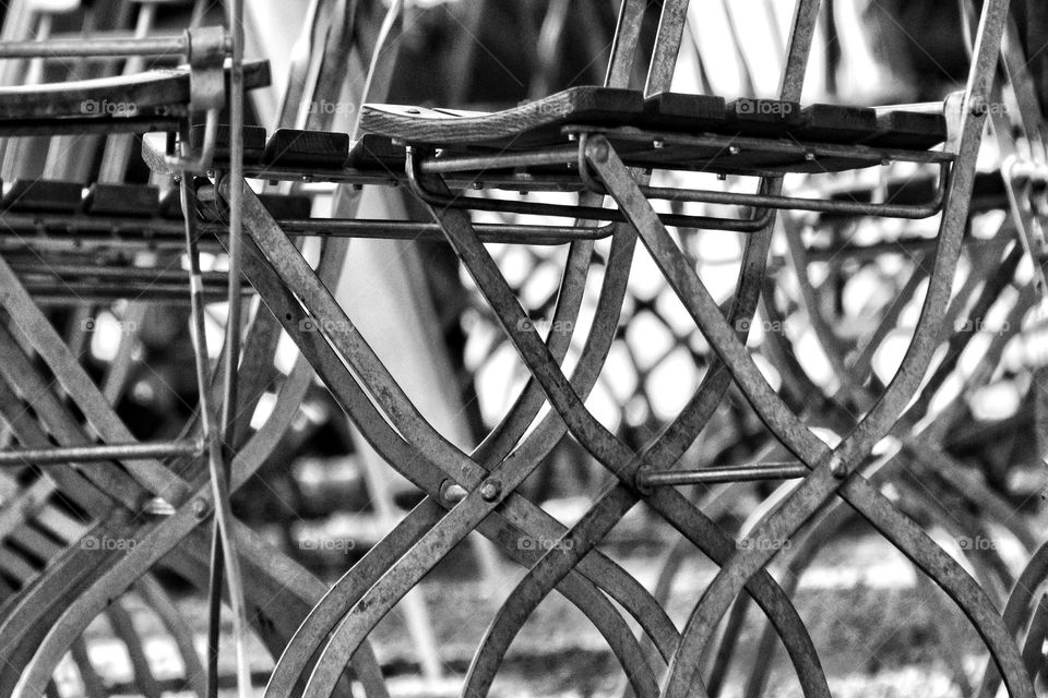 Black and white photo of folding chairs from a worm's eye view 