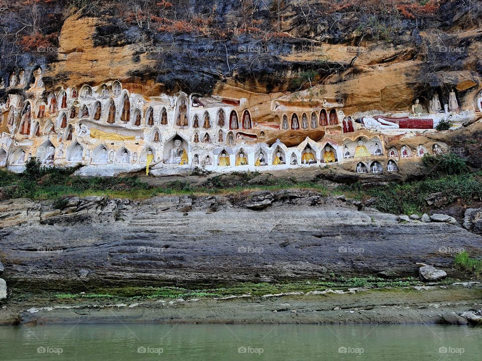 The craving reclining and meditating Buddhas into the steep cliff at Akauk Taung, Myanmar (Burma)
