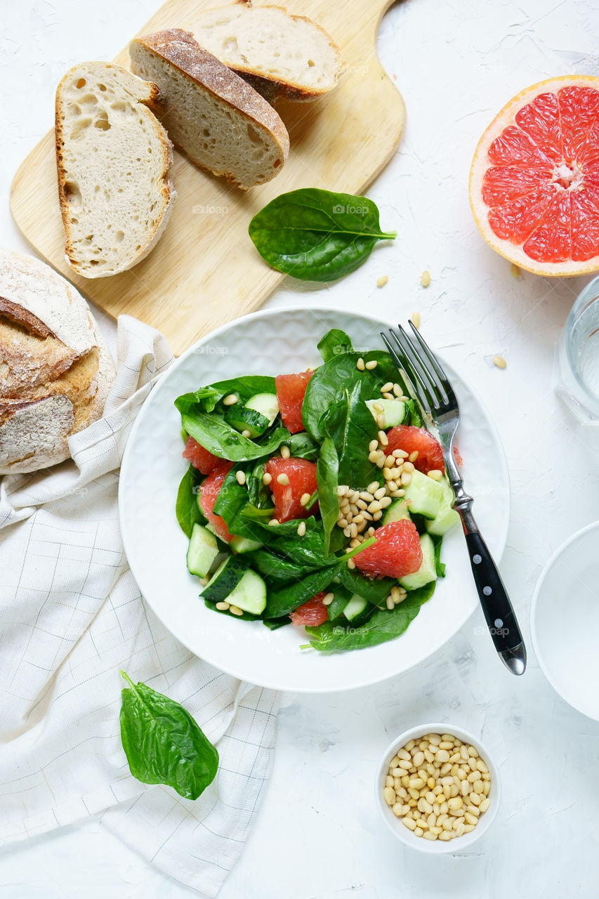 Close-up of green salad with bread