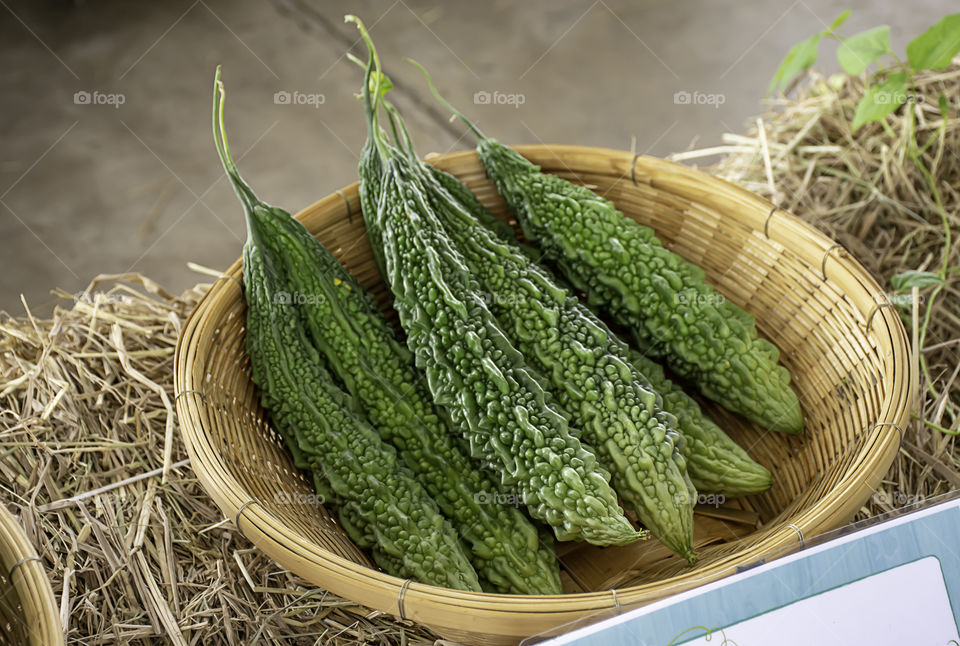 Bitter gourd fresh from the garden in bamboo baskets.