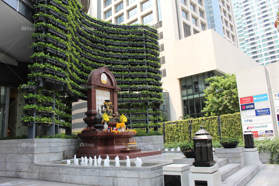 Shrine amidst the skyscrapers at Bangkok Thailand 