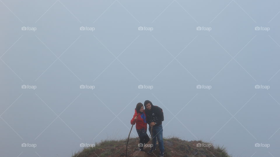 lovers atop a mountain