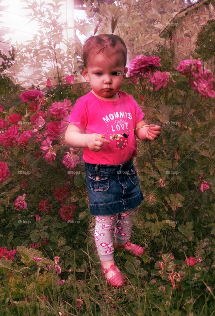 Cute girl standing in the garden