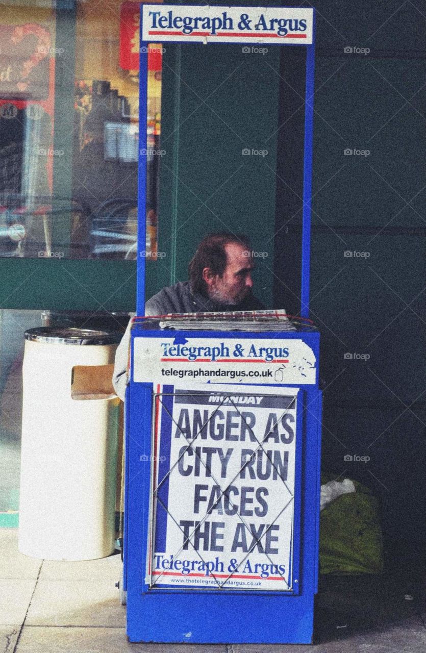 Guy in news stand England
