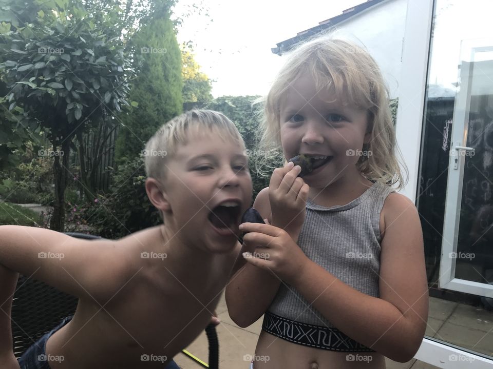 Eating first plums of the season 