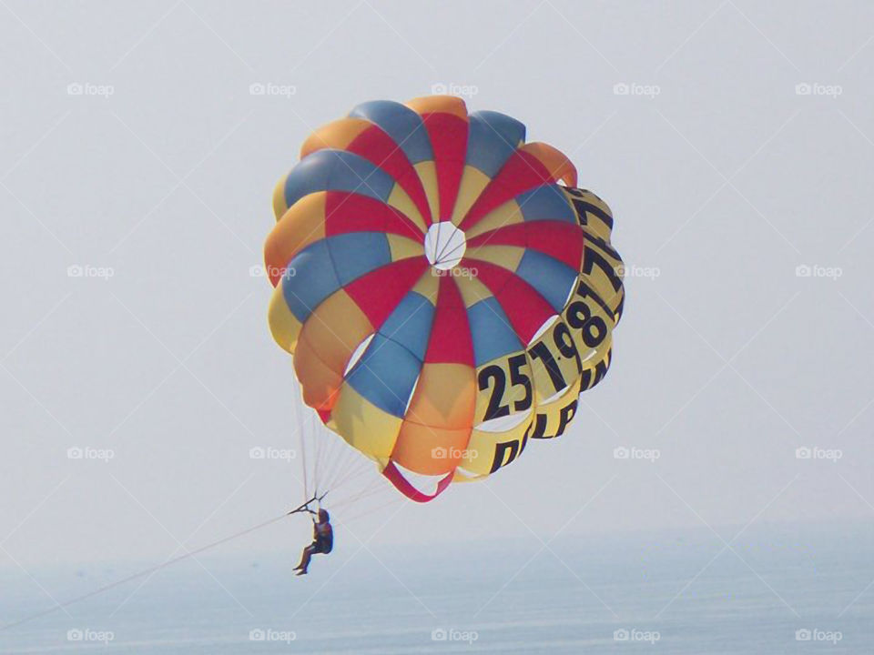 Parasailing at Orange Beach 4. A person parasailing in Orange Beach Alabama.