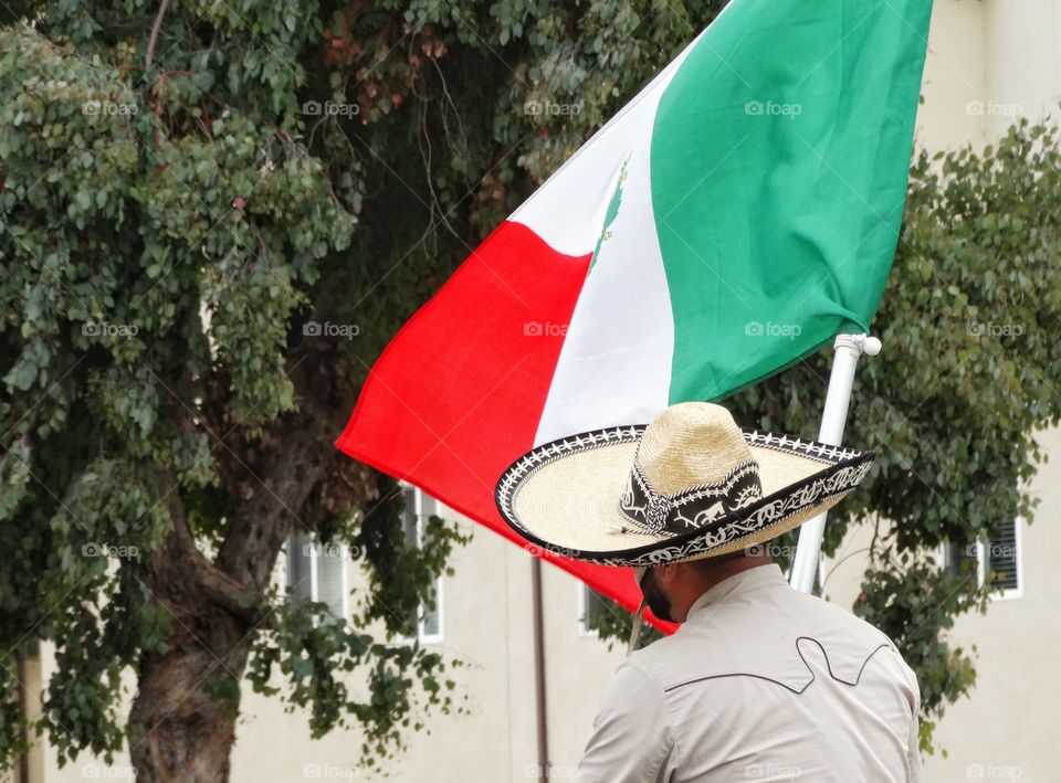 Mexican Pride. Proud Vaquero Carrying The Mexican Flag
