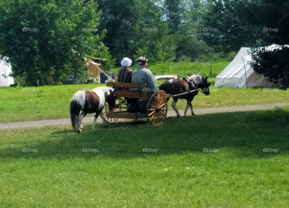 Reenactors with ponies show us how to live a slower - paced life