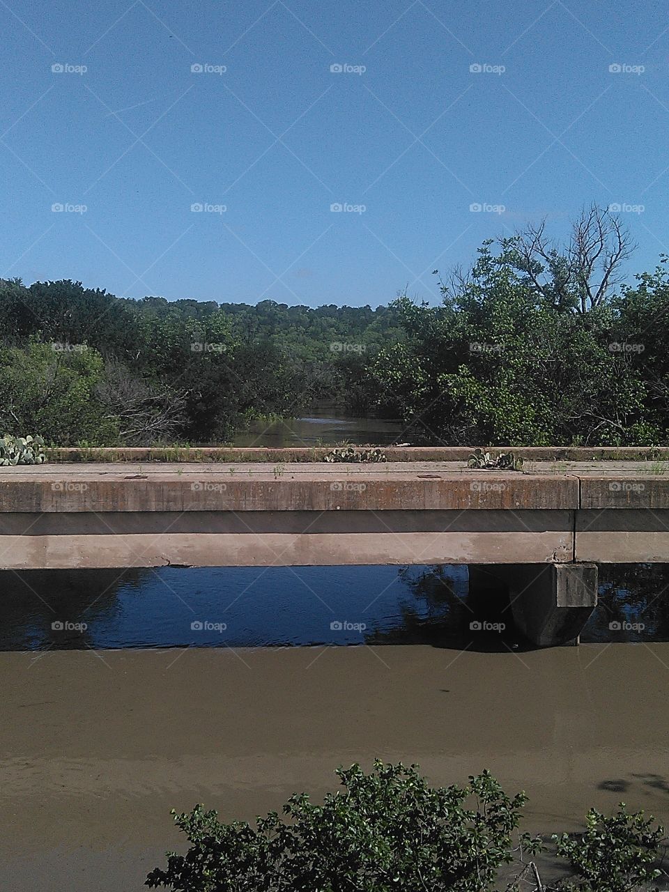 old county bridge. this old bridge  crosses the brazos river
