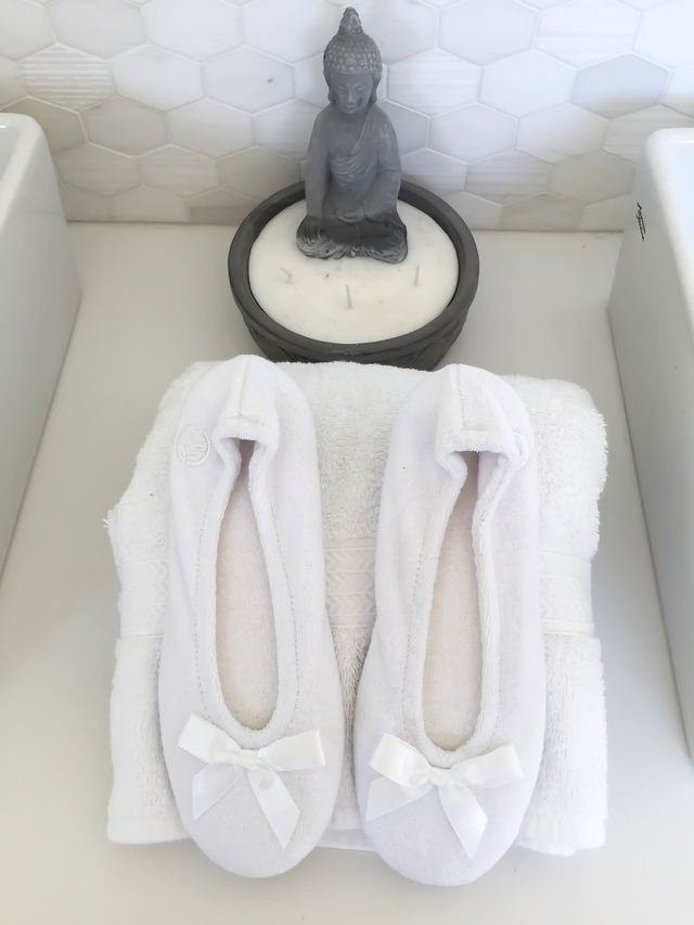 White slippers and towels equals warm and cozy after a bath 