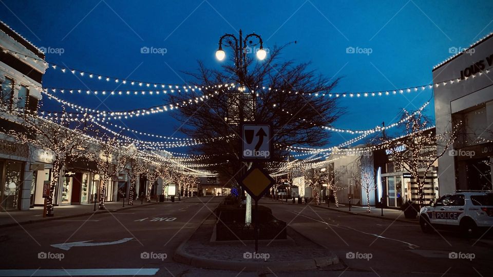 An early morning commute to the local Coffee bar. Few are out on this cold morning, but no doubt they have the same goal in mind. They’re greeted by holiday lights not yet taken down. Beautiful accents to the buildings and trees.