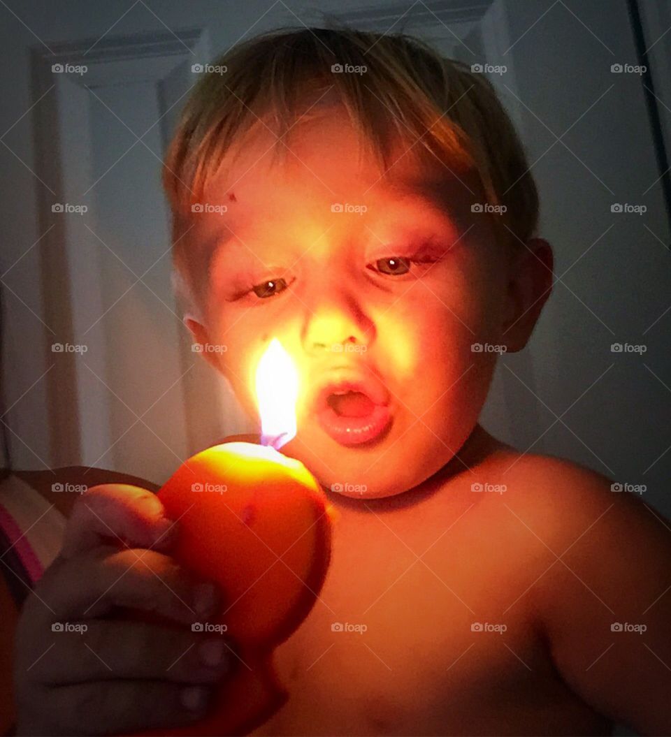 Happy Birthday, Baby!. Birthday boy blowing out his candle. 