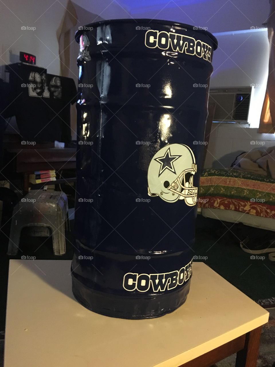 30 gallon trash can with authentic Dallas Cowboys stickers,dark blue paint and clear coat.