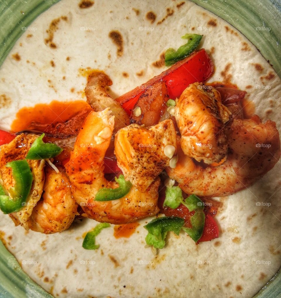 Shrimp and Chicken Fajitas with red peppers and jalapeños.