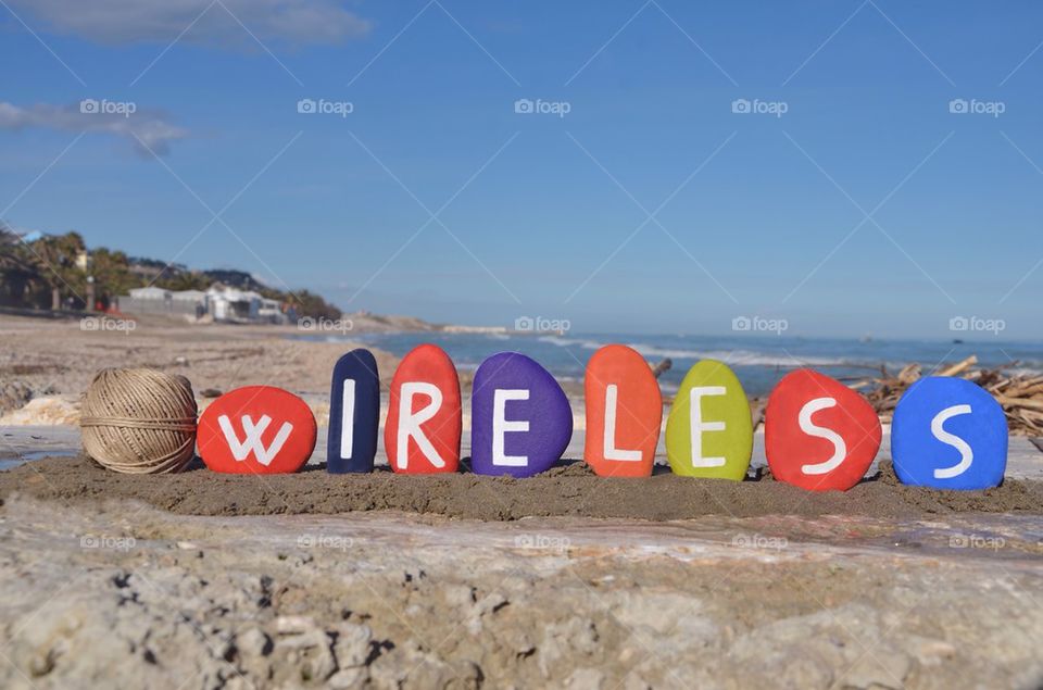 Wireless concept with colourful stones