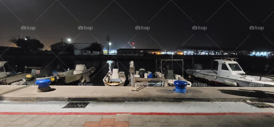 Row of boats docked on the shore