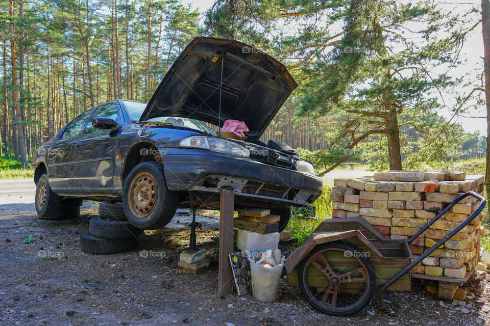 a fun car repair in a rural area