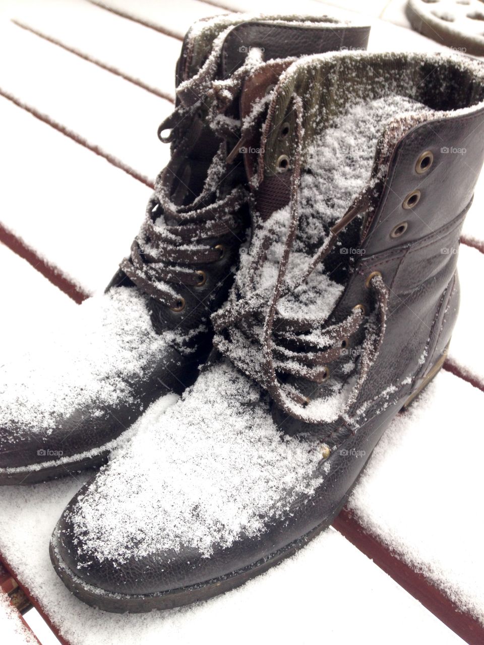 Boots covered in snow
