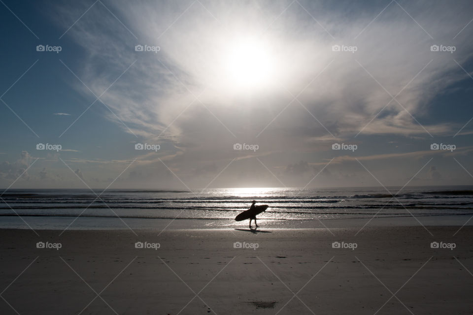 Surfer at dawn