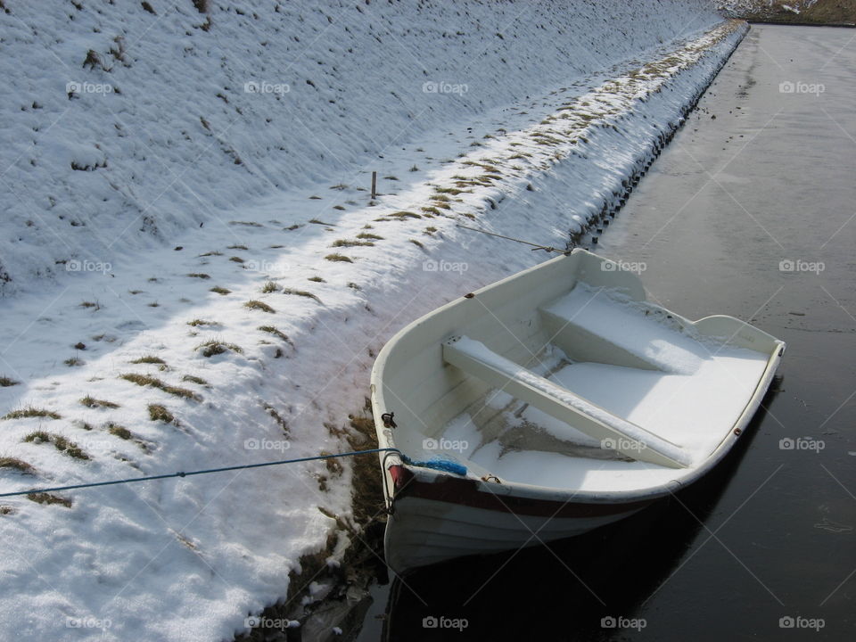 row boat in the snow
