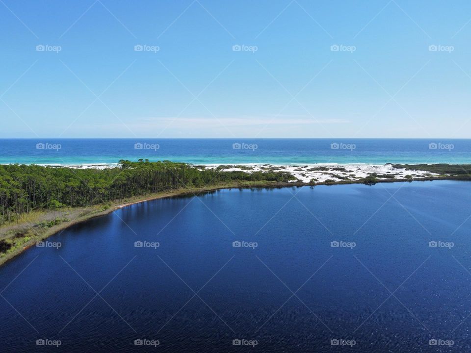 Clear blue sky water florida panhandle summer vacation relaxation bay ocean