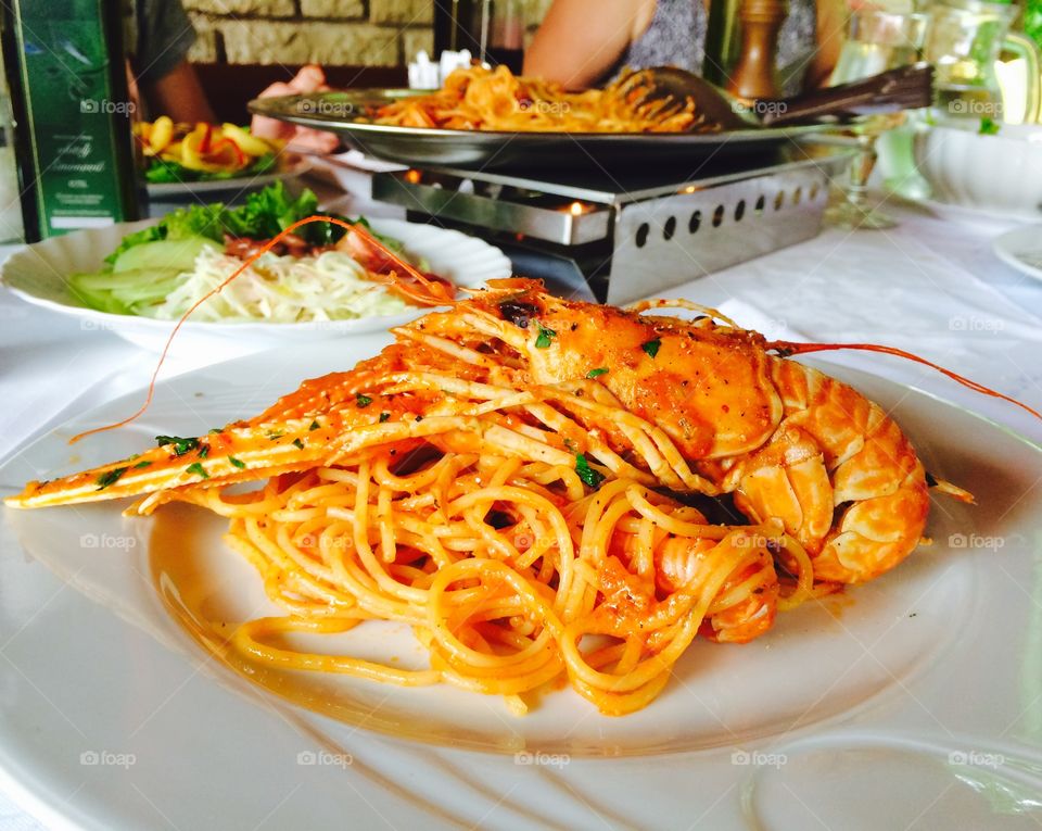 Spaghetti scampi. Famous mediterranean food; spaghetti scampi