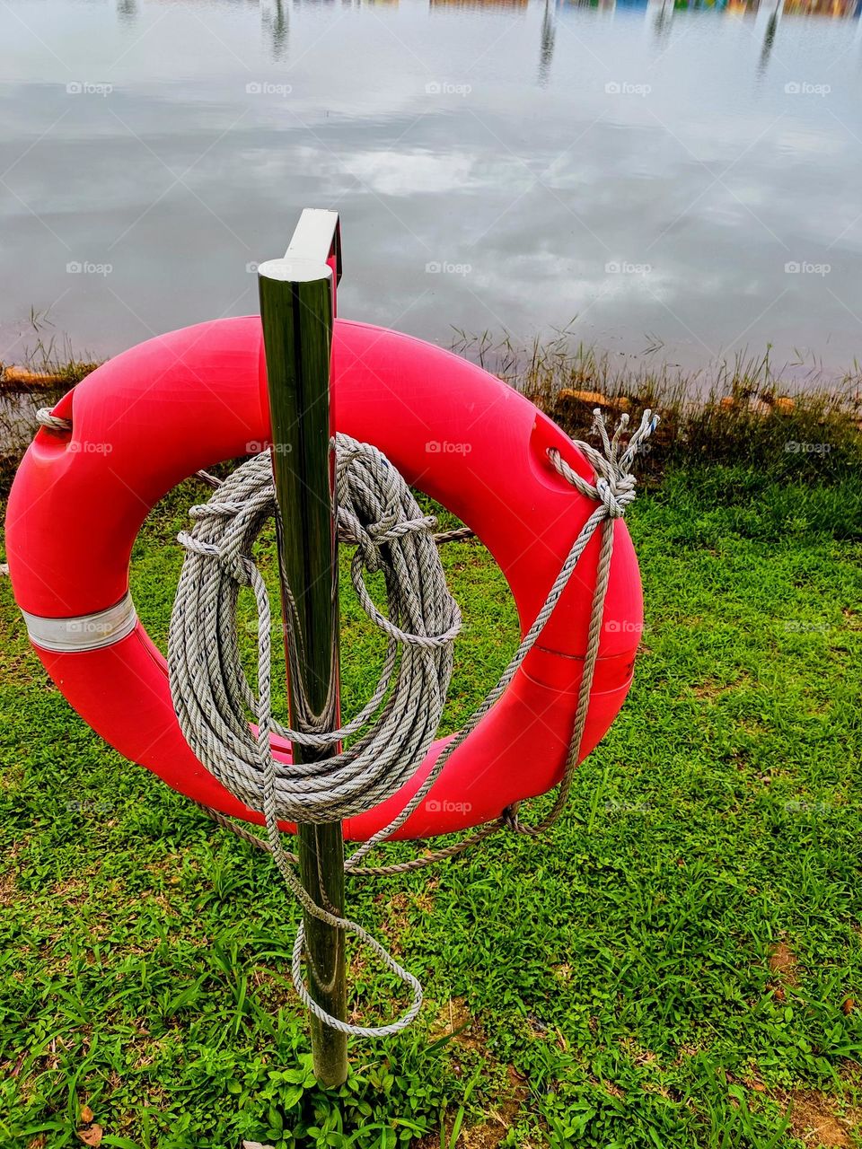 A lifebuoy hanging on the stand.