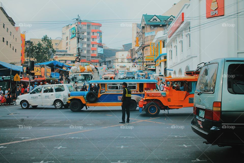 Police officer in the middle of a rush hour madness.