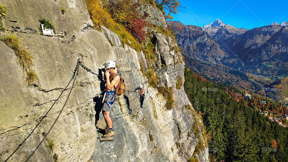 Two friends climbing a high mountain in Zermatt, Switzerland.