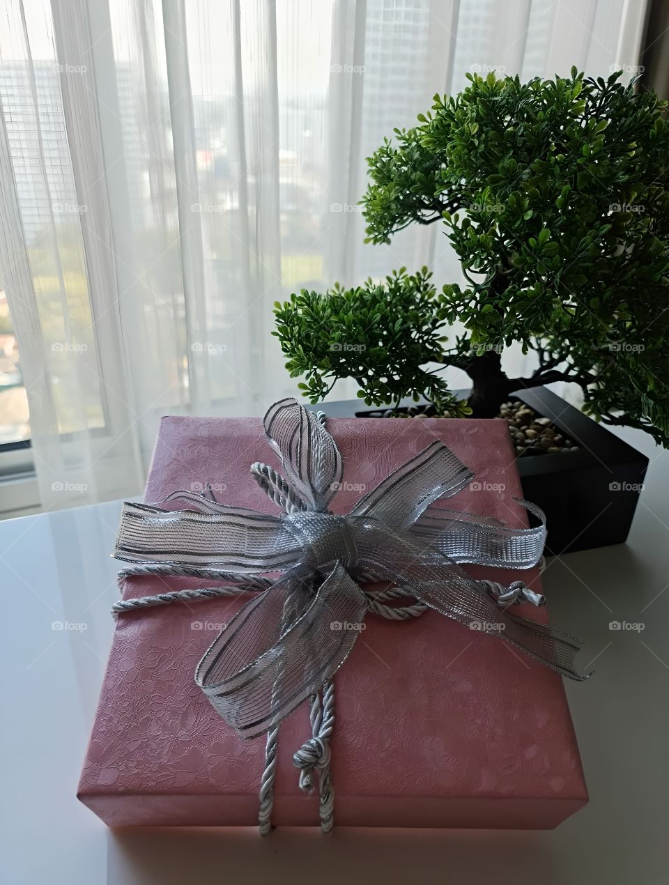 pink beautiful present box with a ribbon