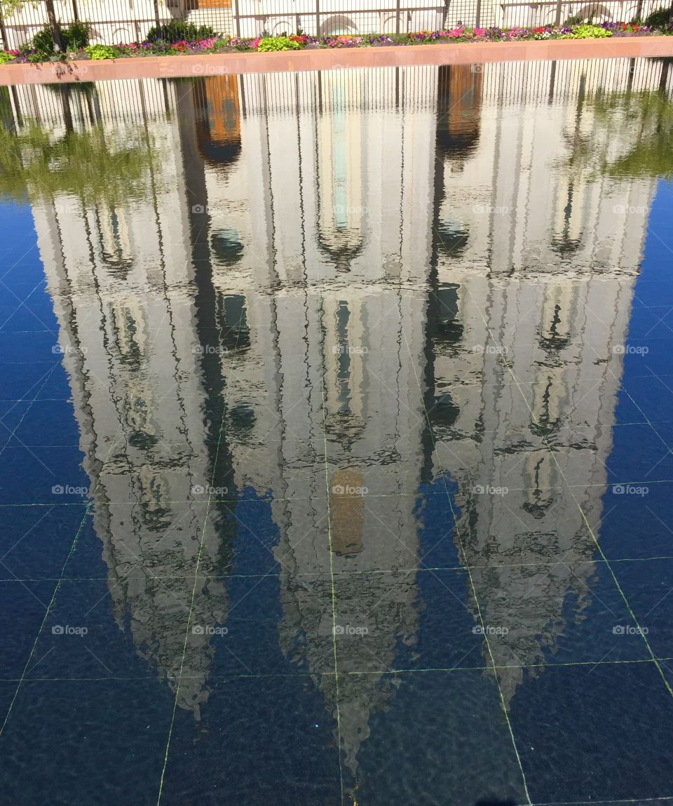 Building reflection in pool