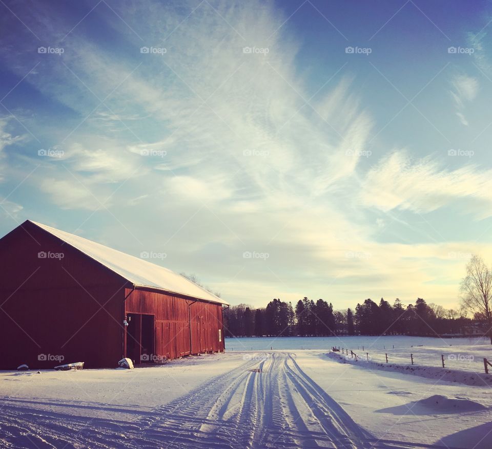 Red barn in winter landscape