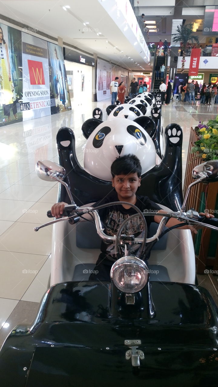 my son mehran riding seat on toy train in my city mall he was so exited to ride the toy train