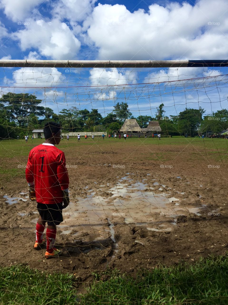 Football match in the Amazon rainforest! Beautiful greens and reds in this photo! 
