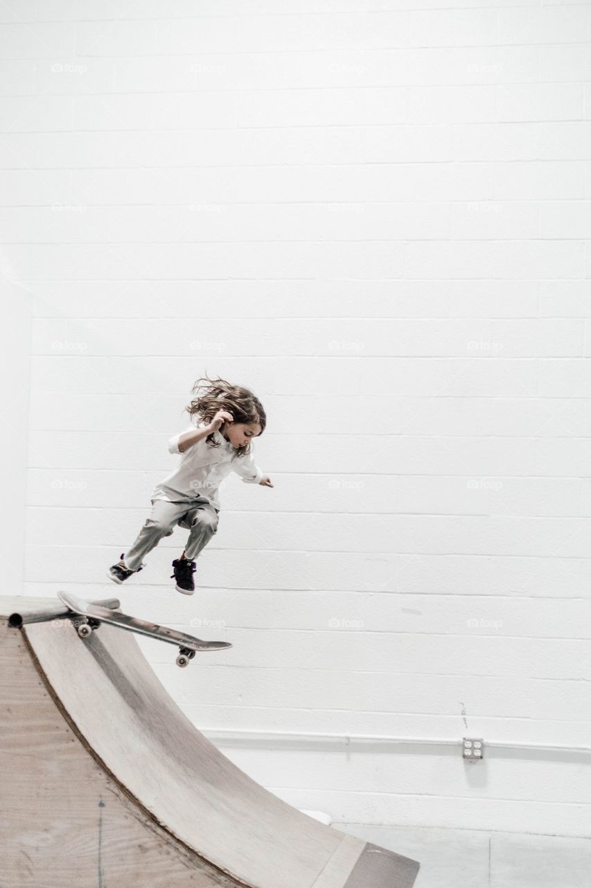 little girl playing skateboard